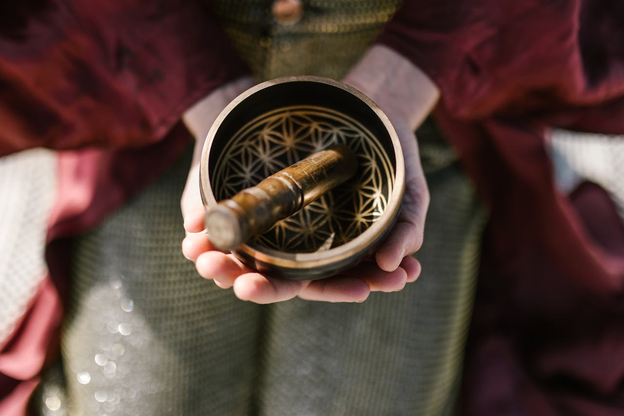 Mastering the First Impression: Your intriguing post title goes here Close-up of hands holding a ornamental singing bowl, symbolizing spirituality and mindfulness.